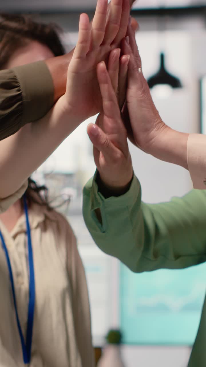 Vertical Video Group of corporate women working on data analysis and setting project goals