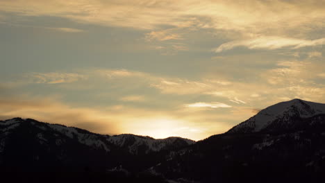 beautiful sunset over snowy mountains with the idaho pass during golden hour in wyoming united states prores 4k