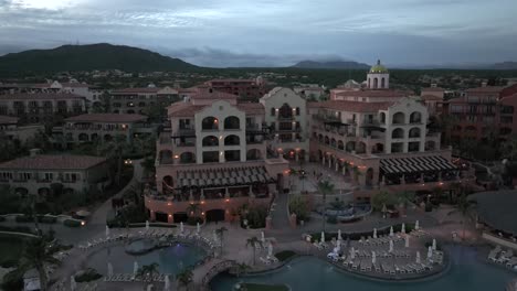 hacienda del mar, los cabos, mexico at dusk - descending aerial view of resort, landscape, pools