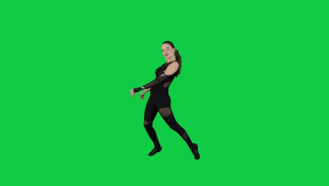 Stunning-slow-motion-dance-performance-by-young-brunete-woman-wearing-a-black-outfit-in-front-of-the-green-screen