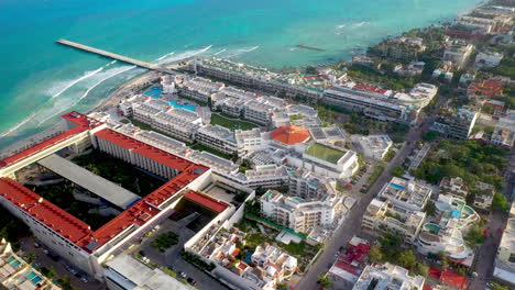 Cinematic-drone-shot-of-resorts-on-the-coastline-at-Playa-Del-Carmen-Mexico