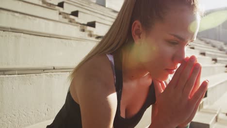 Thoughtful-caucasian-athlete-in-stadium