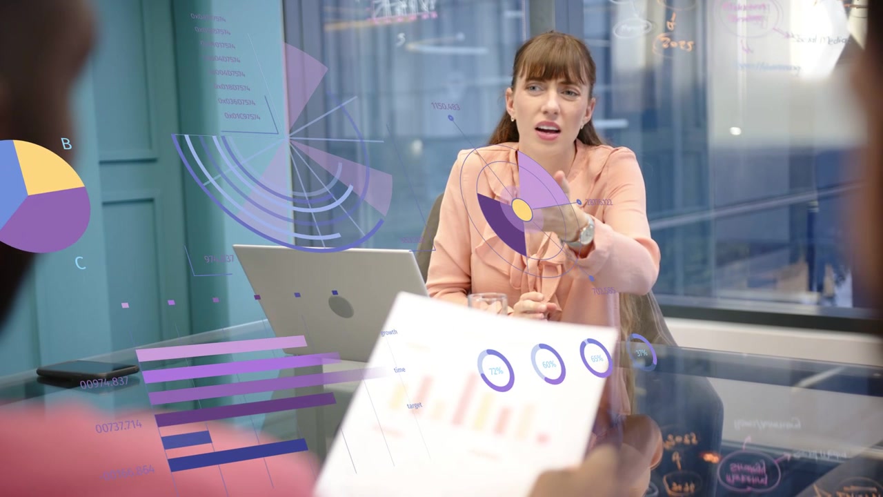 Woman leaning speaking as colleague showing report causing AR business charts on glass table
