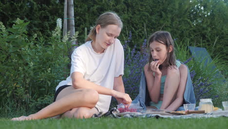 sisters enjoying a picnic in the garden