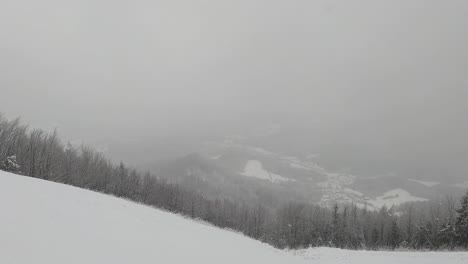 a panorama view of a snowy landscape with a beautiful mountain backdrop