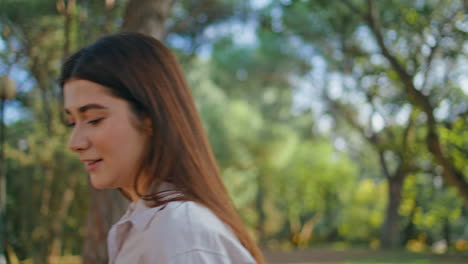 profile hopeful woman looking serene in park daylight closeup. nature calm