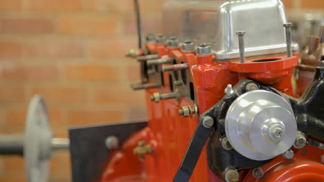 Red-Car-Engine-in-Garage-Close-Up-Dolly-Shot-with-Shallow-Depth-of-Field