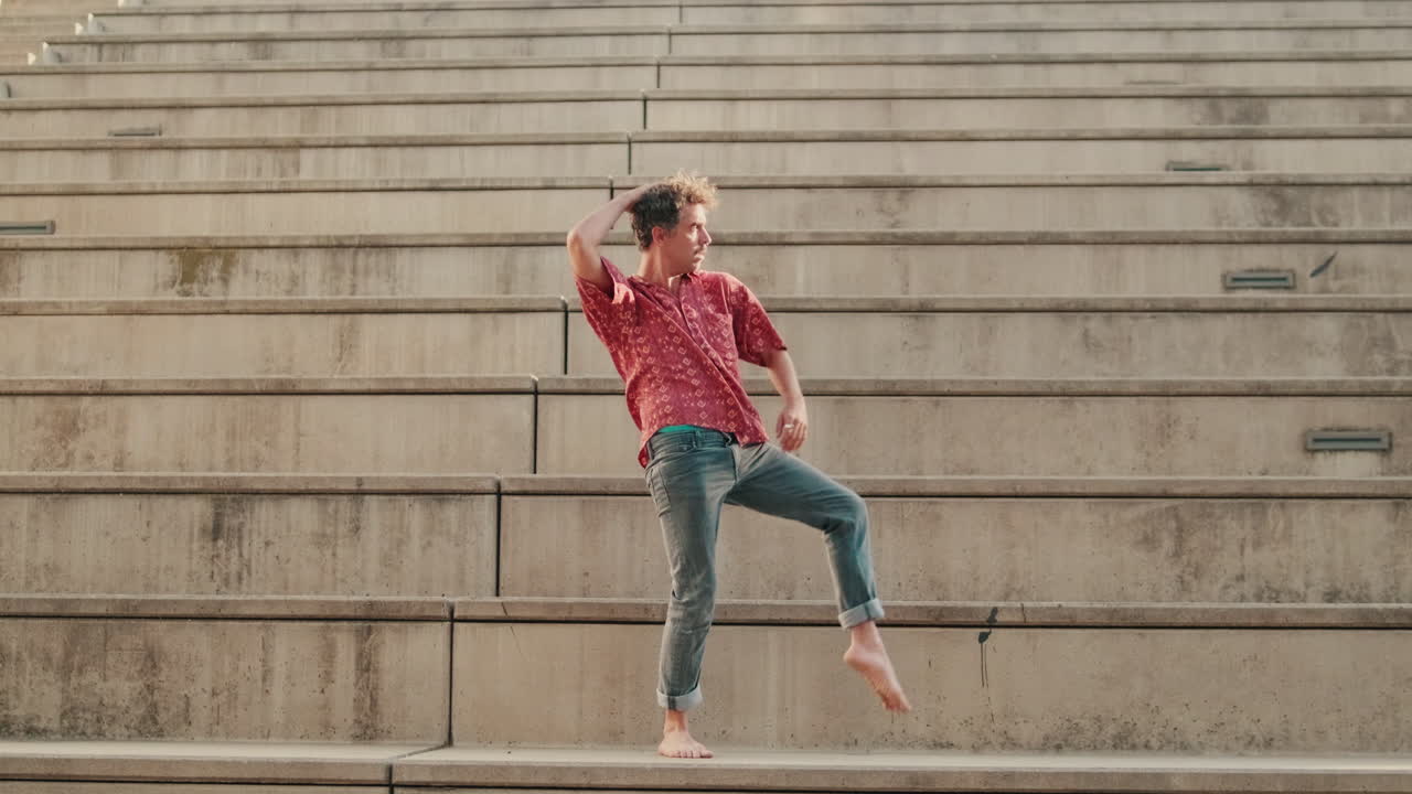 Barefoot Young Man Performing Modern Dance on Concrete Stairs