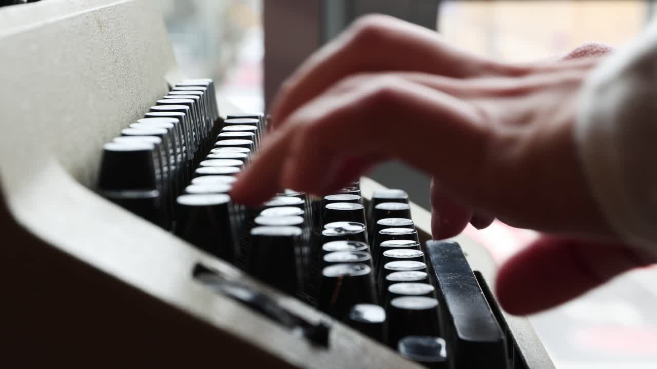 Male Hands Typing On The Keys Of An Old Typewriter
