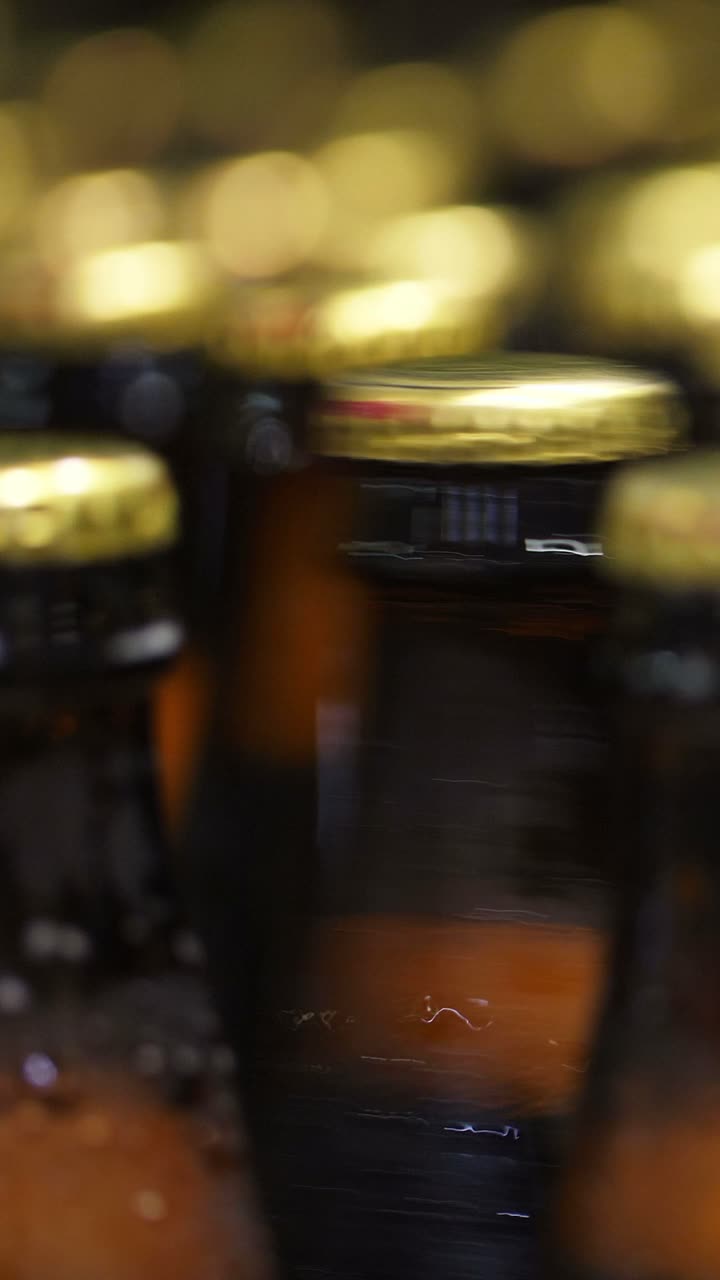 Close-up view of blurred beverage bottles and jars