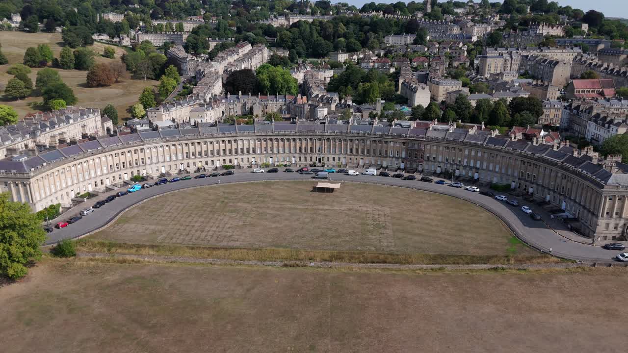 Aerial, wide view of Royal Crescent in Bath, UK on a summers day, central, static framing with off space for titles
