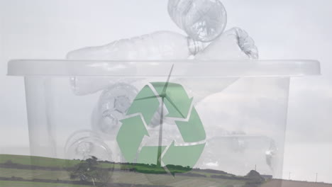 animación de un cartel de reciclaje verde sobre una caja con botellas de plástico y una turbina eólica