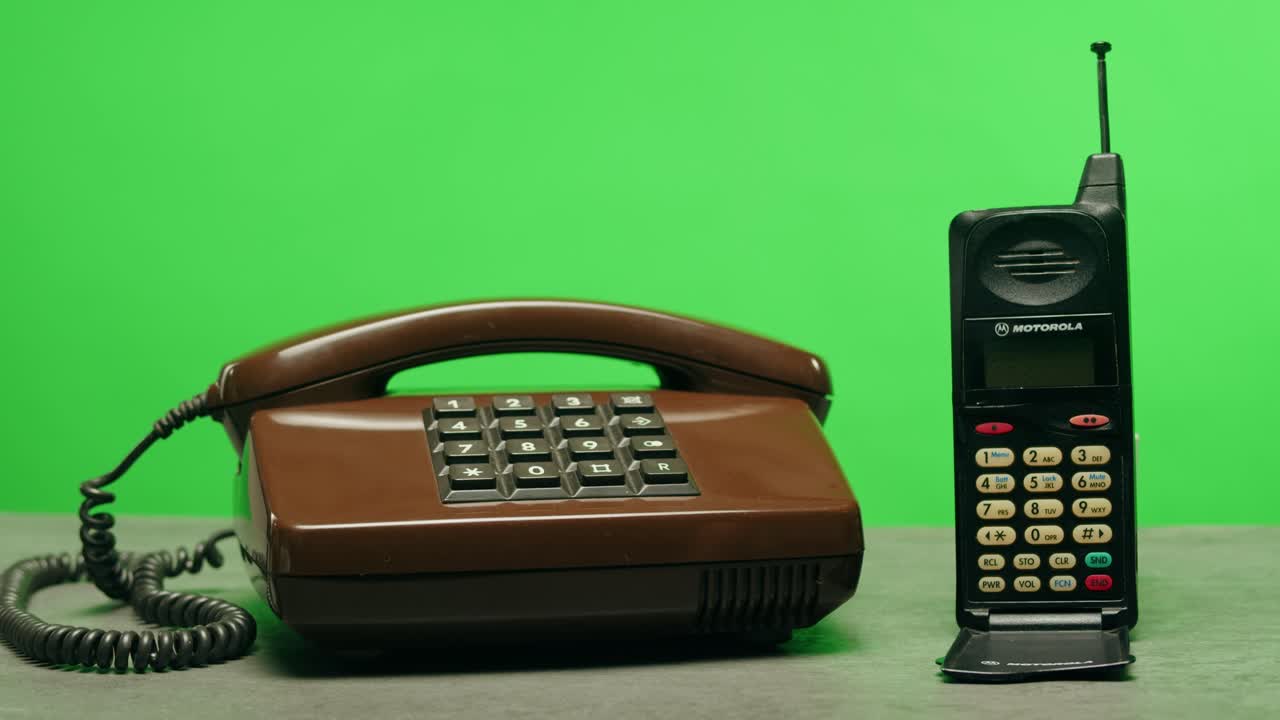 Retro vintage phone, A yellow rotary telephone is displayed on a wooden desk, adding a nostalgic touch