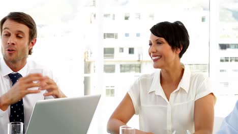 Business-people-chatting-during-a-meeting