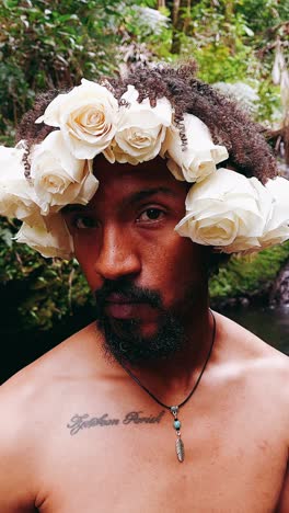 man with rose crown in nature