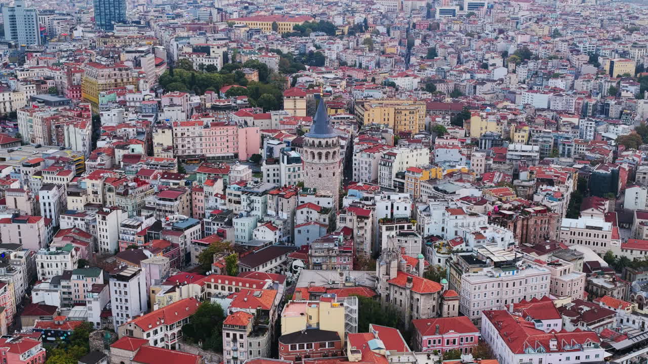 A sweeping view of Istanbul’s dense skyline with the Galata Tower rising at the center, surrounded by historic buildings and colorful rooftops