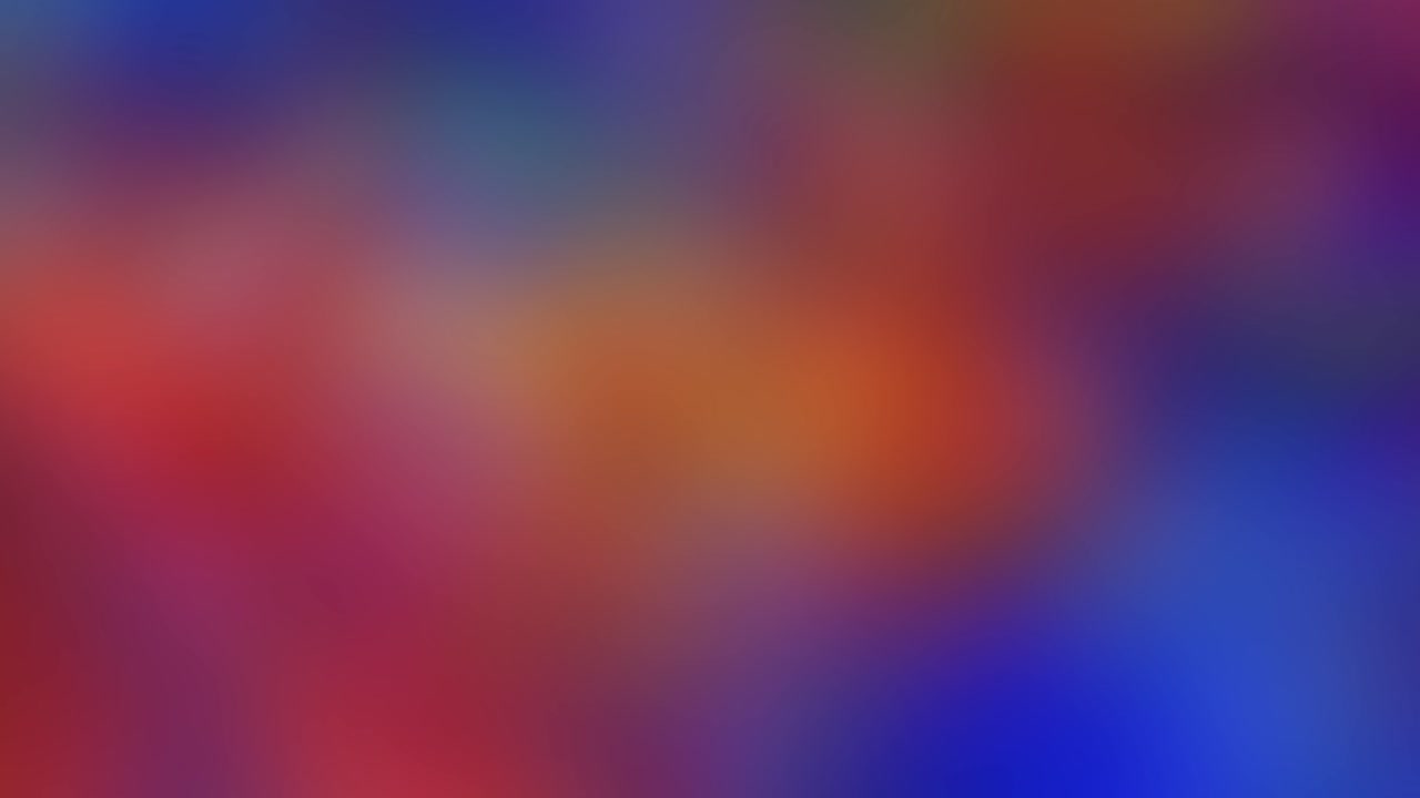 Seamlessly loopable abstract video background featuring a rotating soft blur of vibrant and dark colors, including blue, red, gold, and turquoise, creating a dynamic atmospheric texture