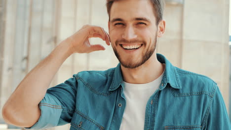 handsome smiling stylish hipster lumbersexual model