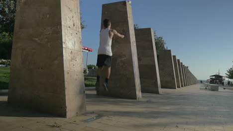Young Parkour Tracer Making Wallflip