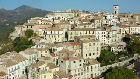 aerial reveal shot of historic hilltop old town trivento in molise region in italy