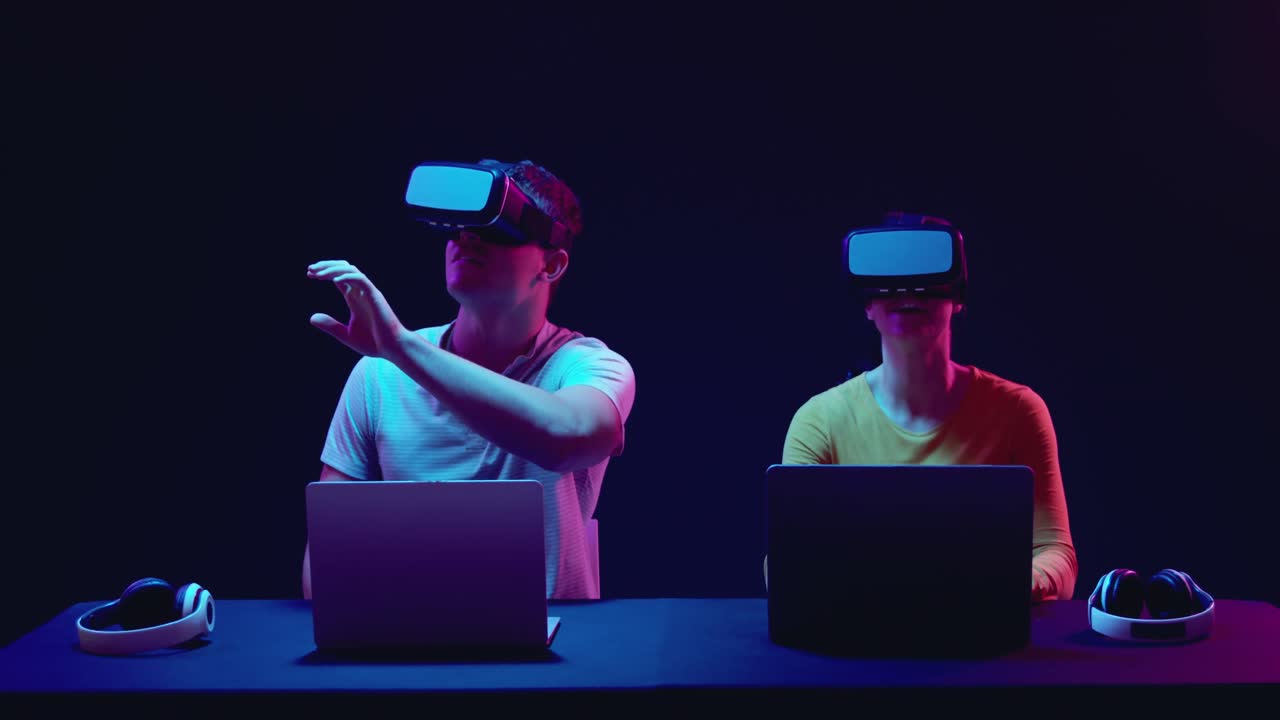 Man and woman wearing VR headsets
