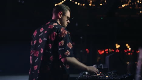 a dj performs at a nightclub