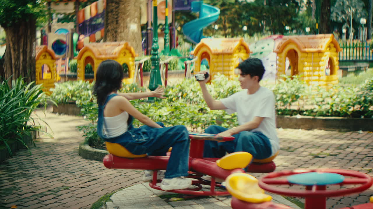 Couple at a playground taking photo