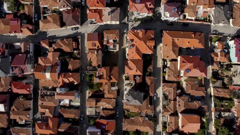 silent alleys with red roof houses in beautiful city of korca in albania, top down view