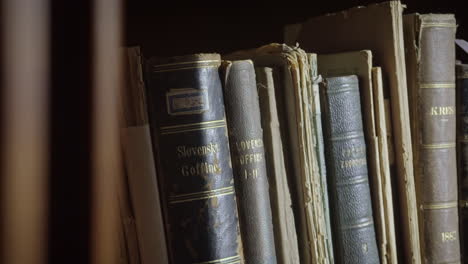 close up shot of old books on the shelve