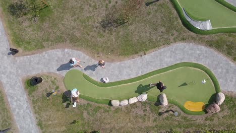 aerial view from above of four people playing