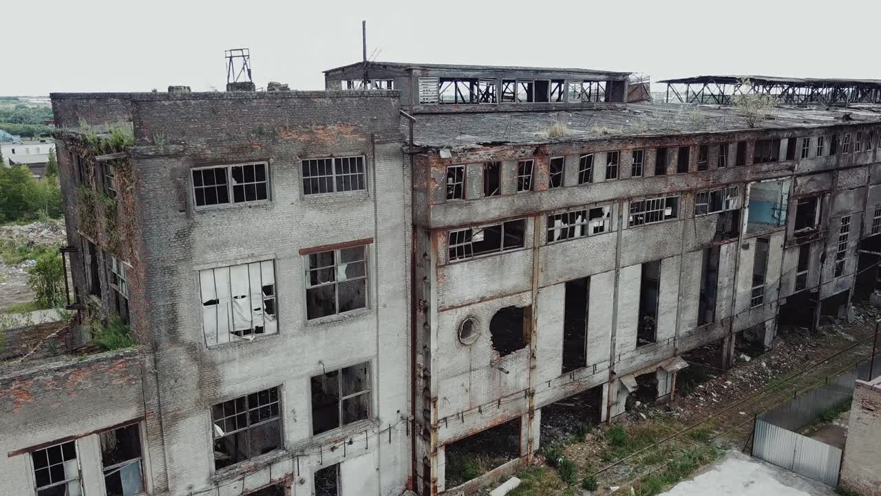 Aerial view from the air to an abandoned factory. Old industrial building for demolition.
