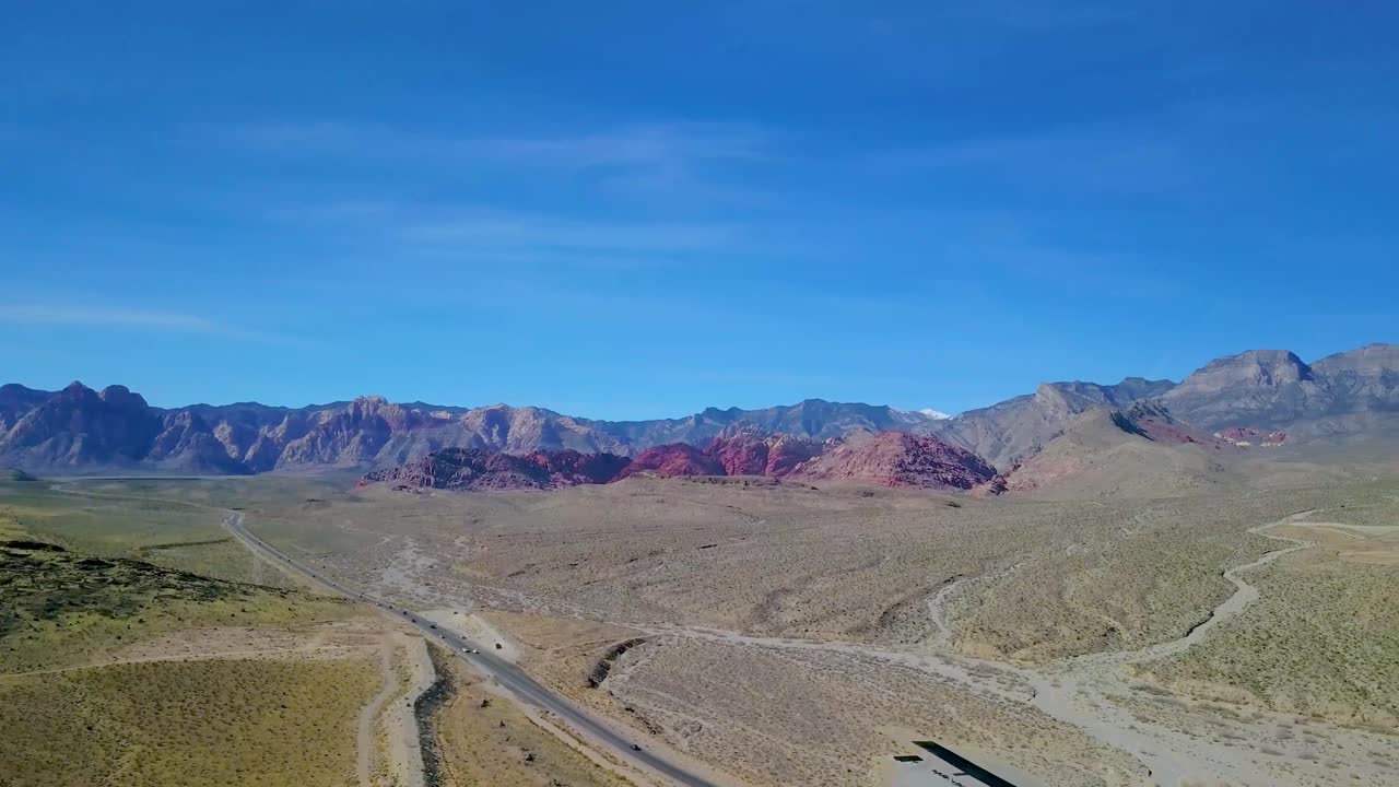 Aerial pan of Red Rocks, Canyon and Desert outside Las Vegas