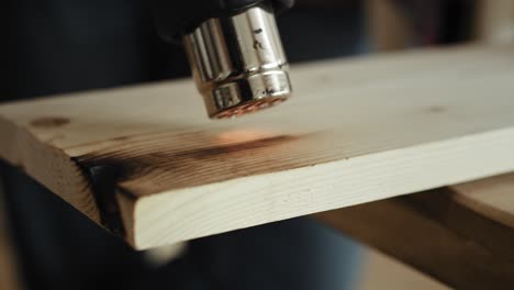 close up video of carpenter using wood heat gun