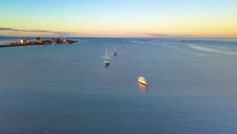 Aerial-over-boats-moored-offshore-at-Kaunakakai-Wharf-Molokai-Hawaii-