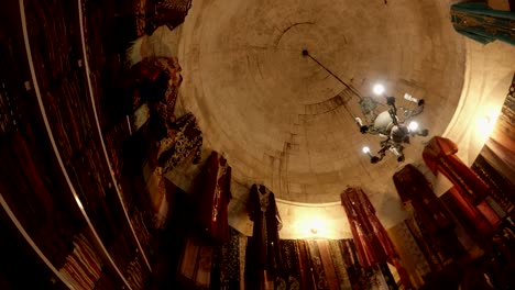 panorama different kind fabric and national turkish cloches interior of ethnic shop  in courtyard of balikligol