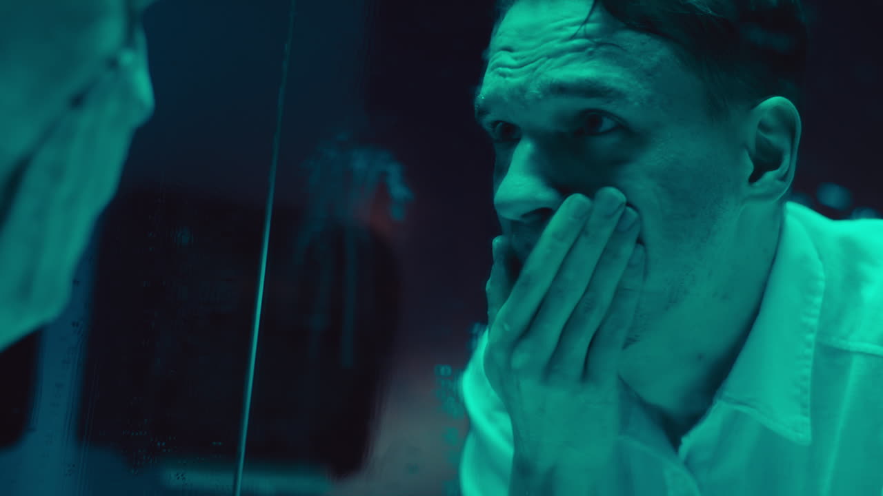 Man Looking in a Mirror with Anxiety