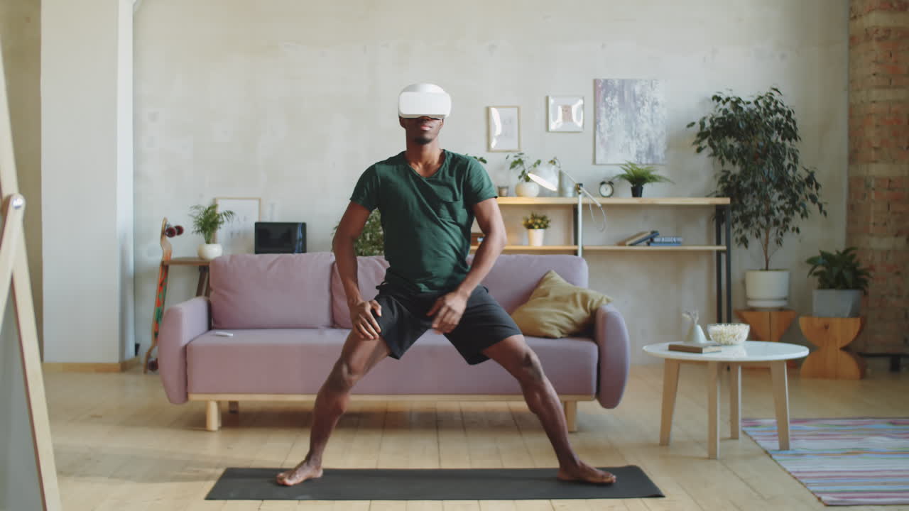 Black Man in VR Headset Practicing Yoga at Home