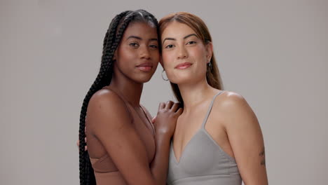 two smiling women posing together