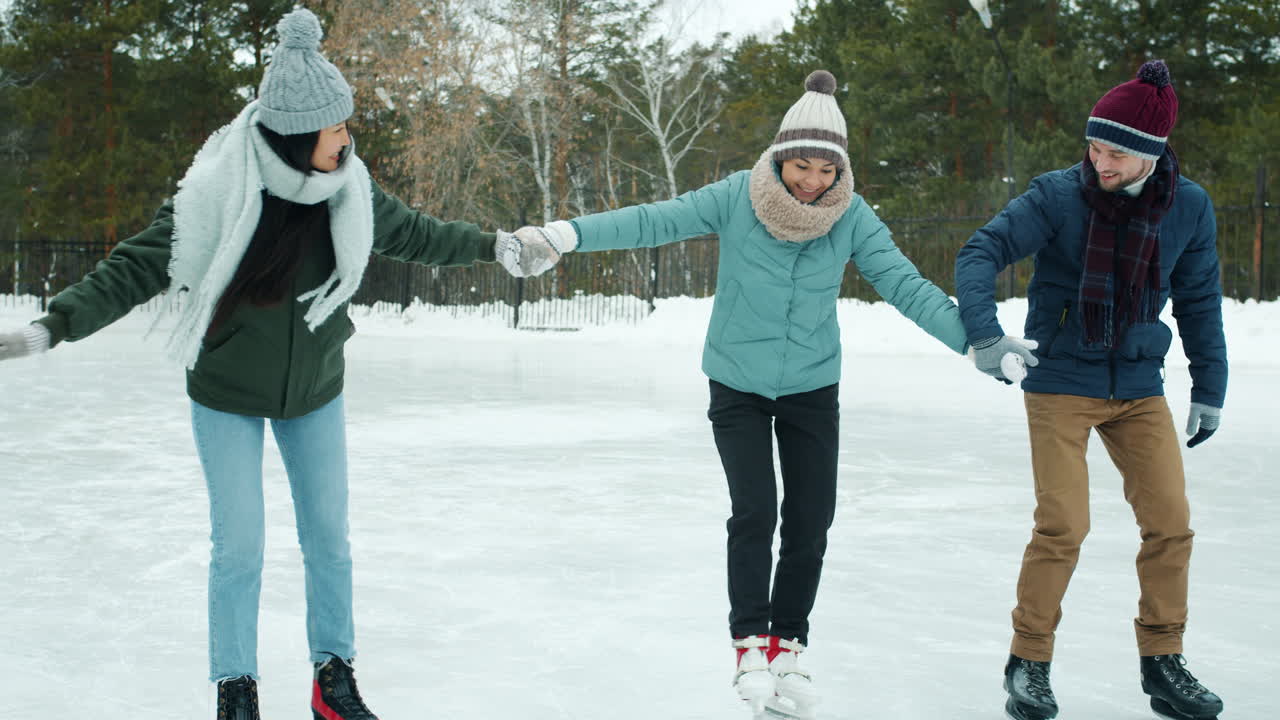 Friends Ice Skating in Winter Park