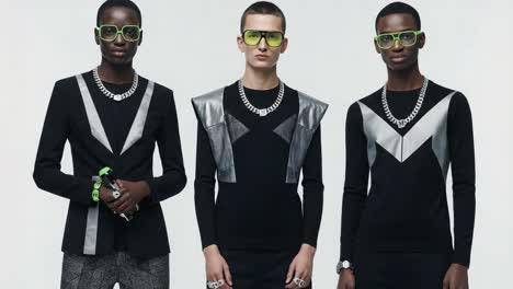 dynamic fashion trio showcasing modern styles with eye-catching outfits and accessories in a chic photographic setting
