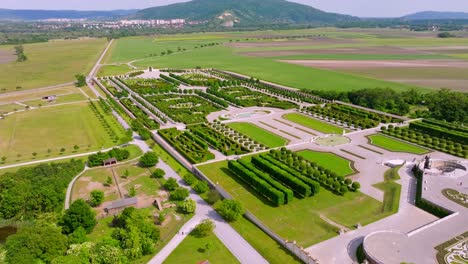 Scenic-Gardens-Of-Schloss-Hof-Castle-In-Austria---aerial-pullback