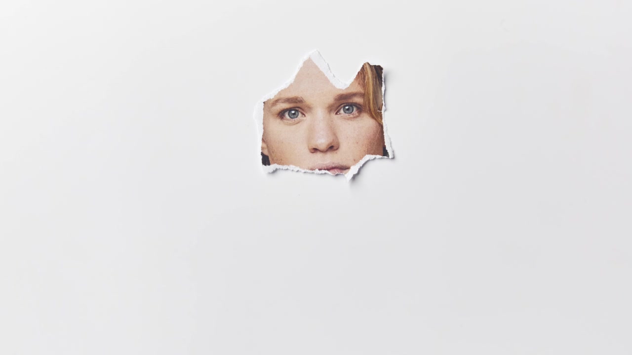 Mental Health Concept With Picture Of Young Woman Having Pieces Torn Away From It Using Stop Motion