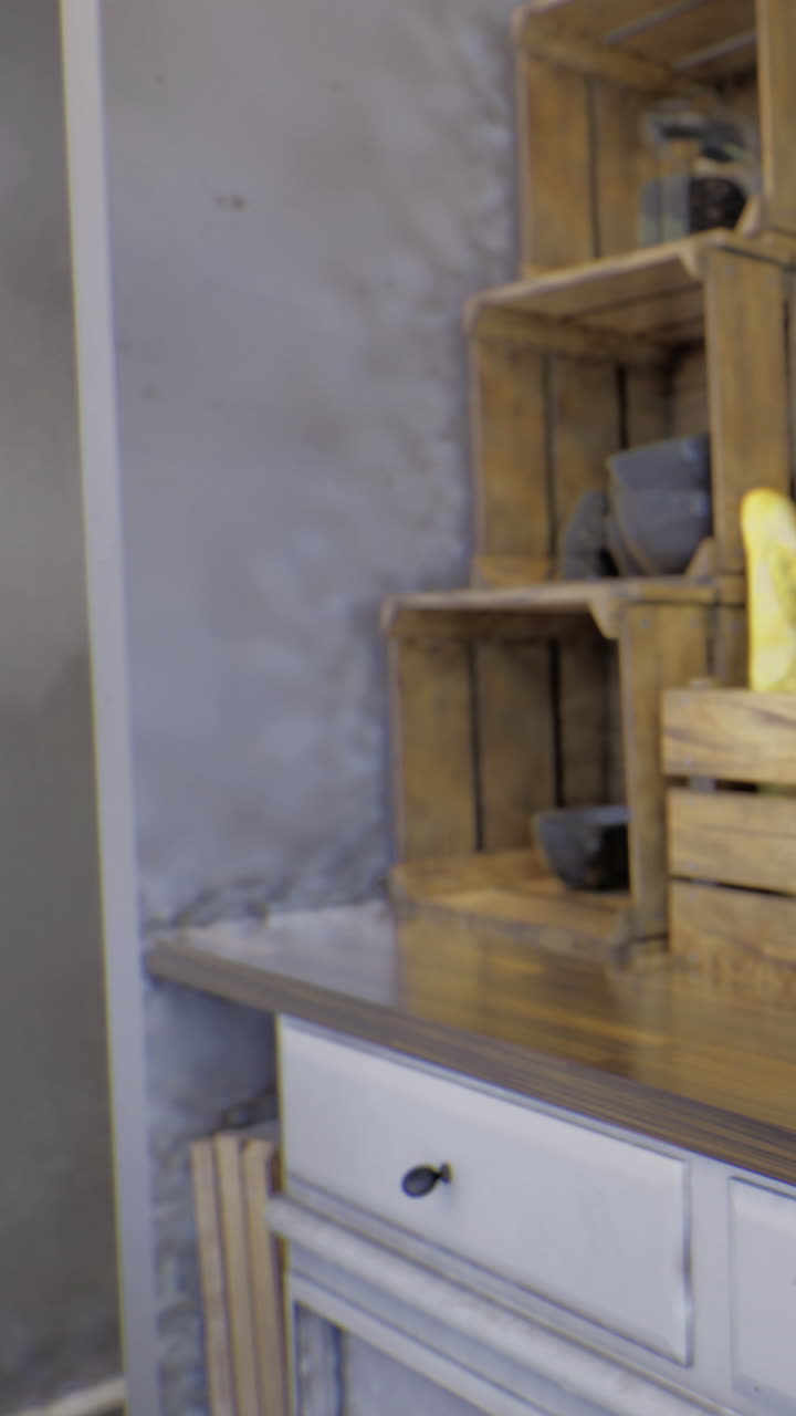 Wooden crates hold items arranged on a table in a simple setting