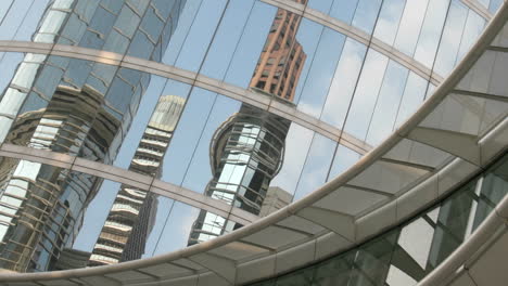 Slow-pan-of-skyscrapers-reflected-in-the-mirrored-walls-of-the-Houston-Oil-Company-building