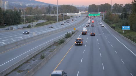 Traffic-on-Highway-seen-fro-Bridge,-Sunset,-Static