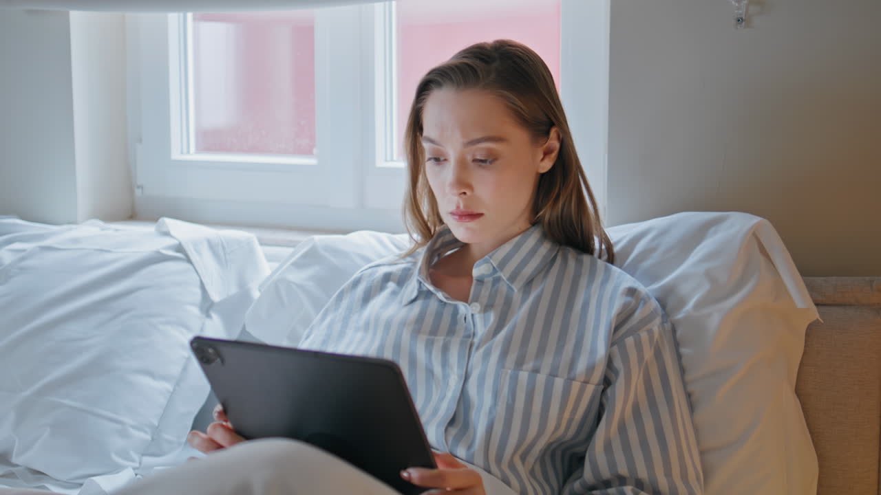 Businesswoman browsing tablet bedroom at morning routine closeup. Serious woman