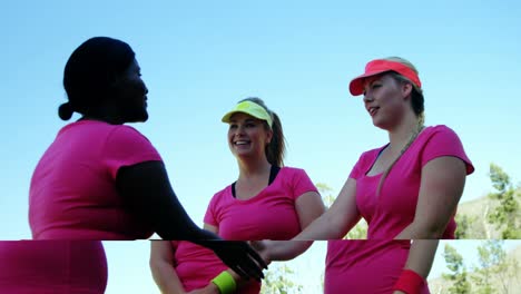 women shaking hands in boot camp