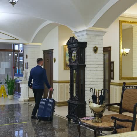 businessman walking to hotel lobby