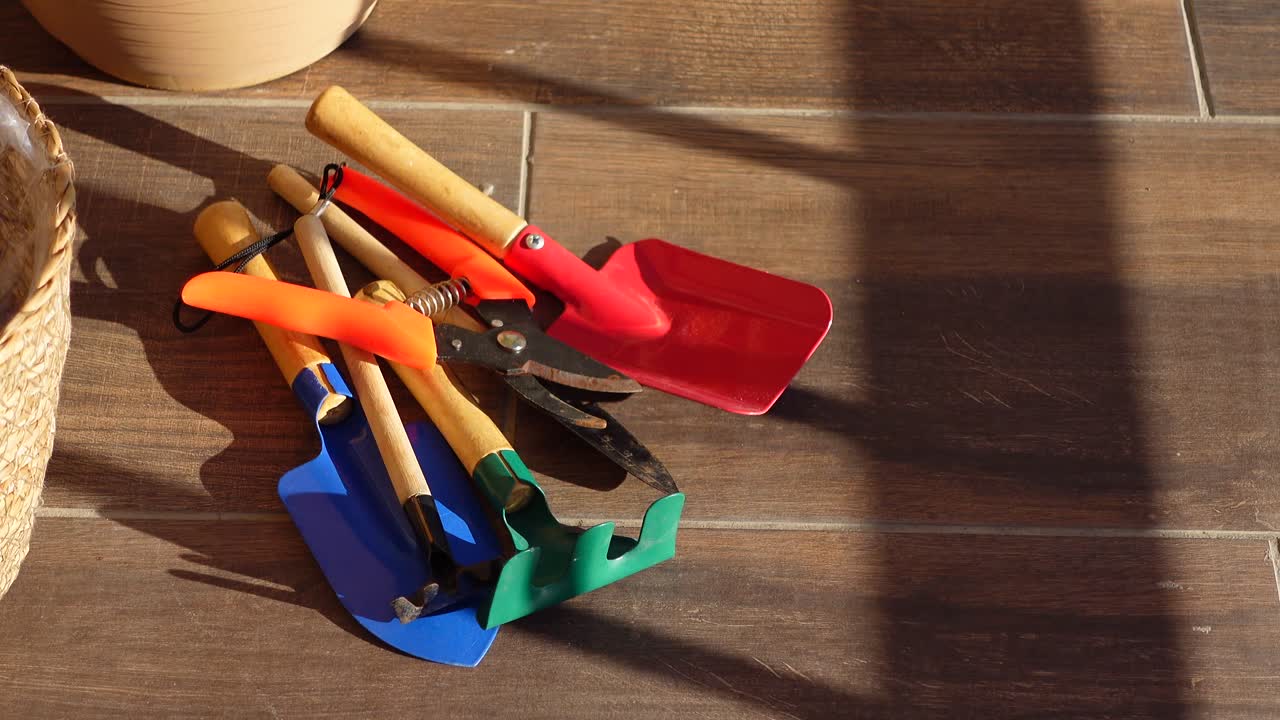 Gardening Tools on Wooden Floor