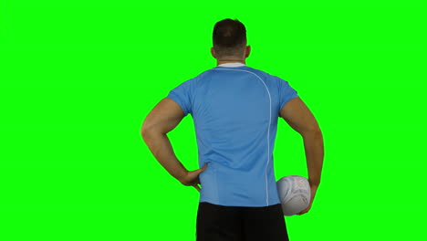 rugby player standing with back to camera